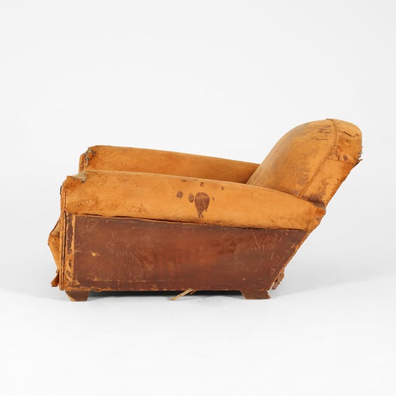 image of Distressed brown leather club armchair