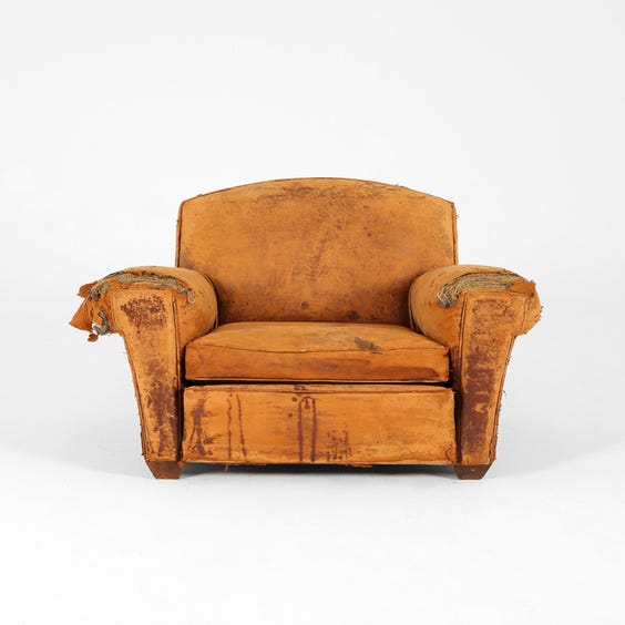 image of Distressed brown leather club armchair