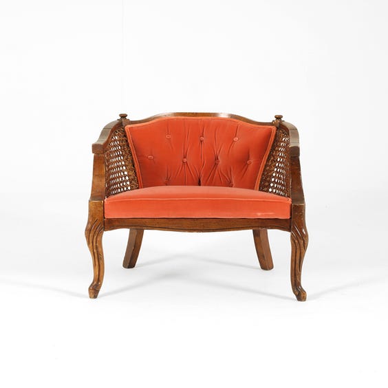 image of Vintage coral velvet rattan armchair