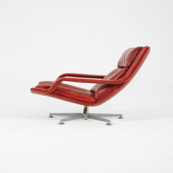image of Red leather swivel armchair