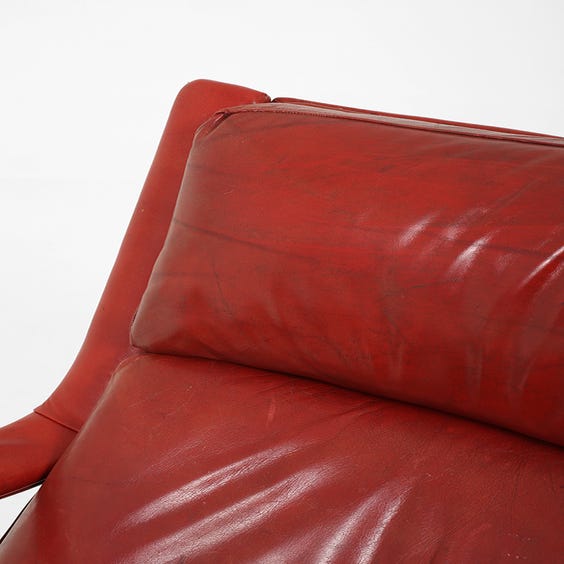 image of Red leather swivel armchair