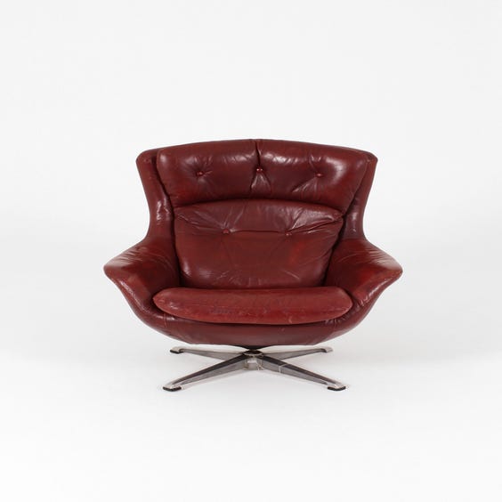 image of Vintage red leather swivel armchair