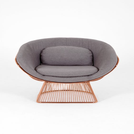 image of Large rose gold spoked armchair