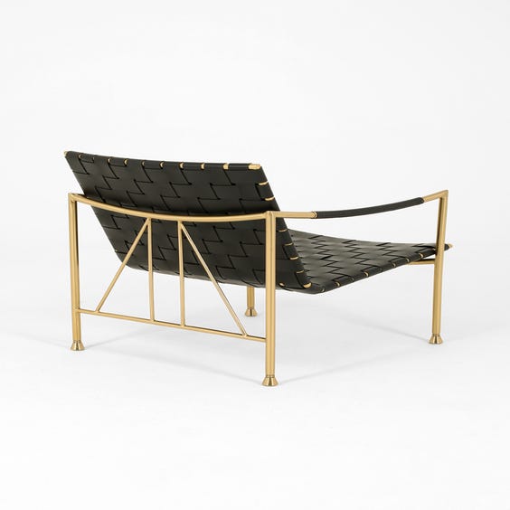 image of Leather and brass lounge chair