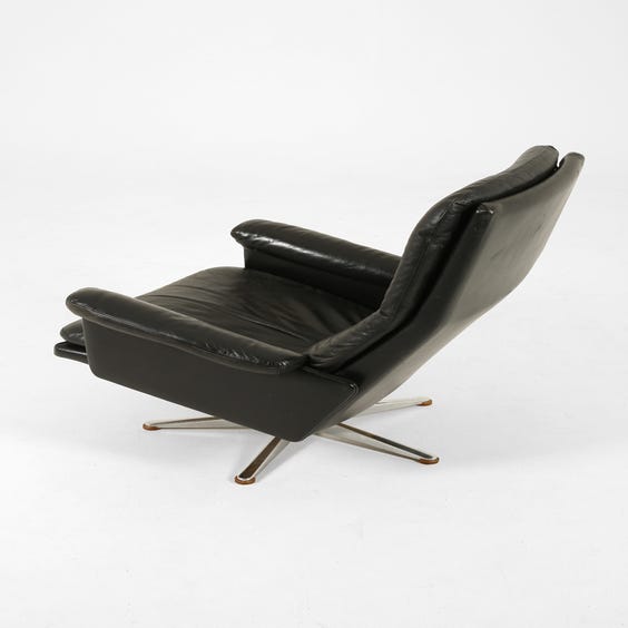 image of Black leather high back armchair