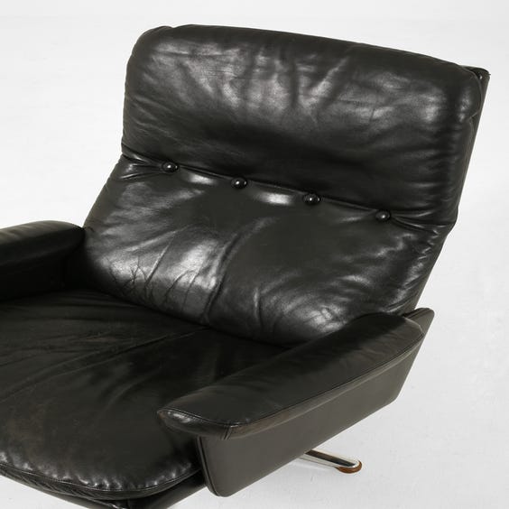 image of Black leather high back armchair