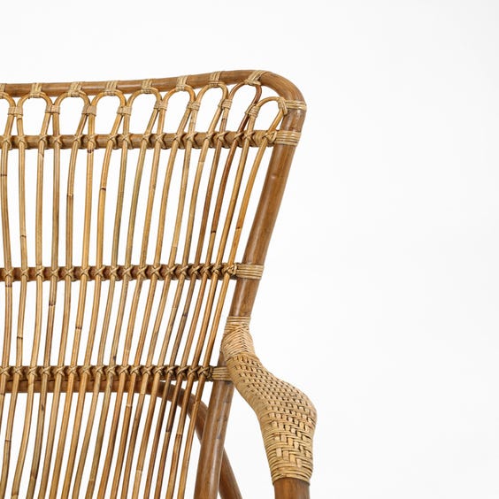 image of Midcentury aged rattan armchair