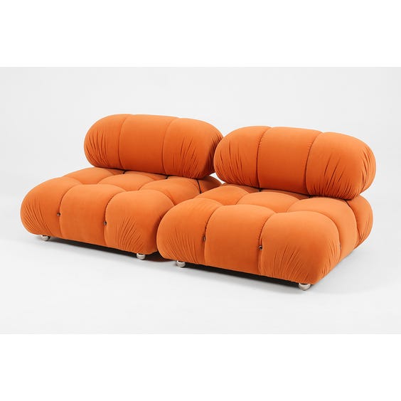 image of 1970s padded pumpkin orange armchair