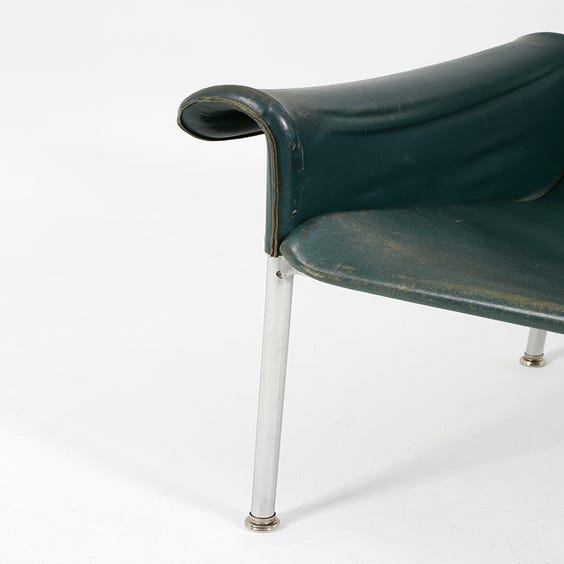 image of 1960's worn teal leather armchair