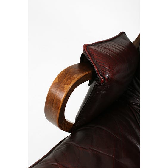 image of Midcentury Danish dark cherry leather lounge chair