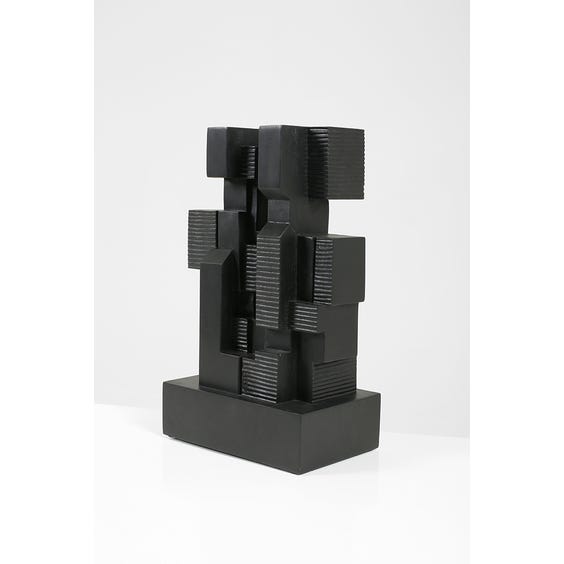 image of Black wooden block sculpture