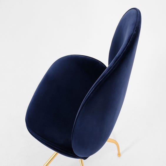 image of Beetle swivel blue velvet chair