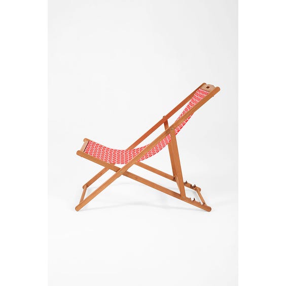 image of 1970's style red orange geometric deck chair