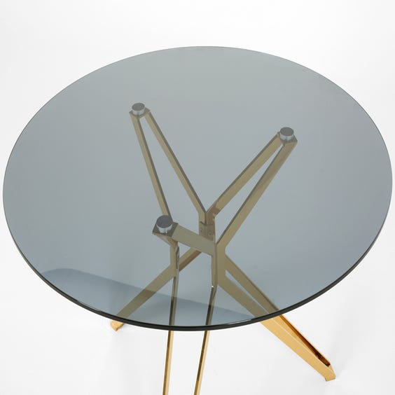 image of Circular smoked glass dining table