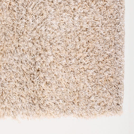 image of Small cream shag pile rug