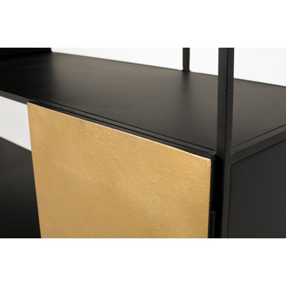 image of Black and gold shelving unit