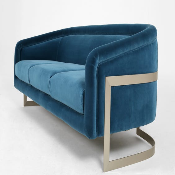 image of Blue velvet three seater sofa