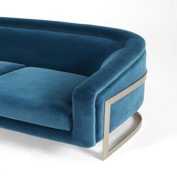 image of Blue velvet three seater sofa