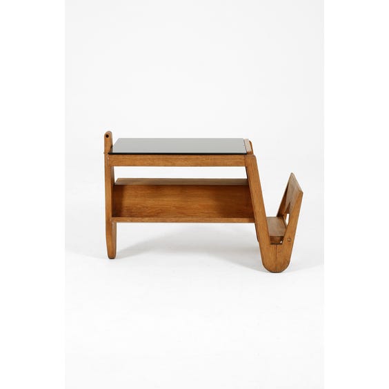 image of Sculptural oak side table with end magazine rack