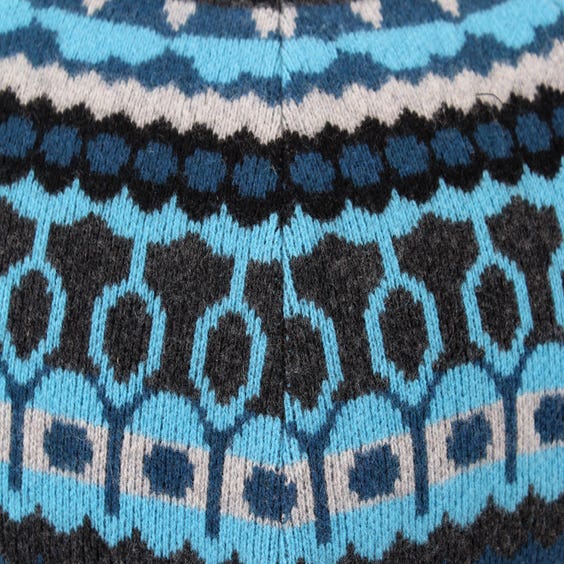 image of Blue knitted wool pouffe