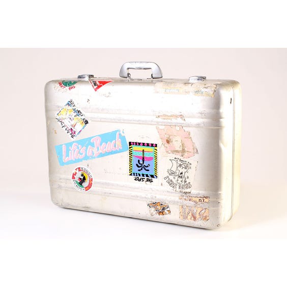 image of Vintage metal suitcase with stickers
