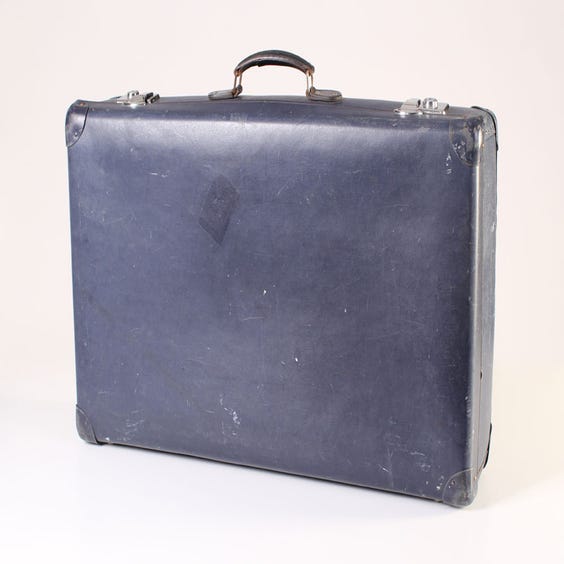 image of Navy blue leather suitcase