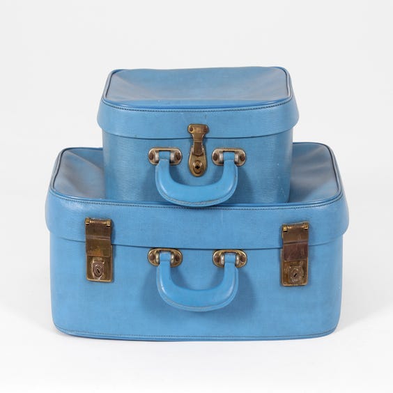 image of Two blue vintage vinyl suitcases