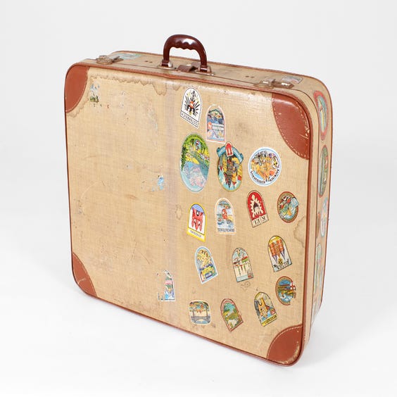 image of Vintage distressed cream tan suitcase