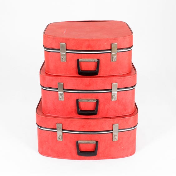 image of Three vintage red vinyl suitcases