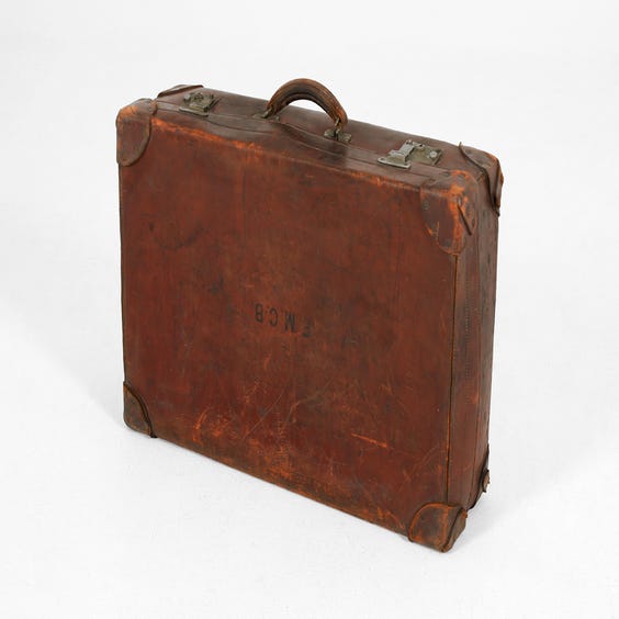 image of Distressed brown leather suitcase