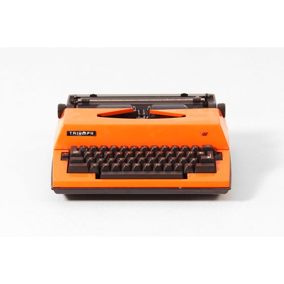 image of Vintage orange Triumph typewriter